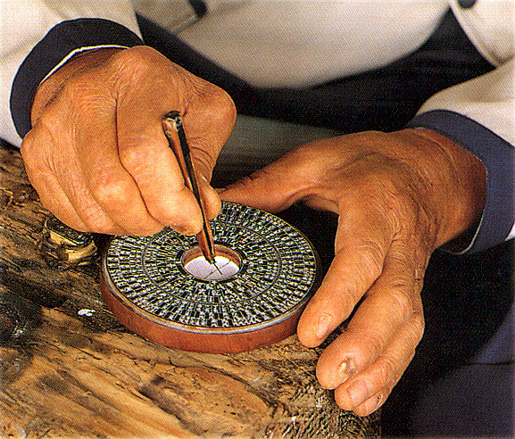 Feng shui expert making compass