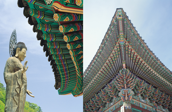 Standing Buddha and Dancheong roof of Korean temple
